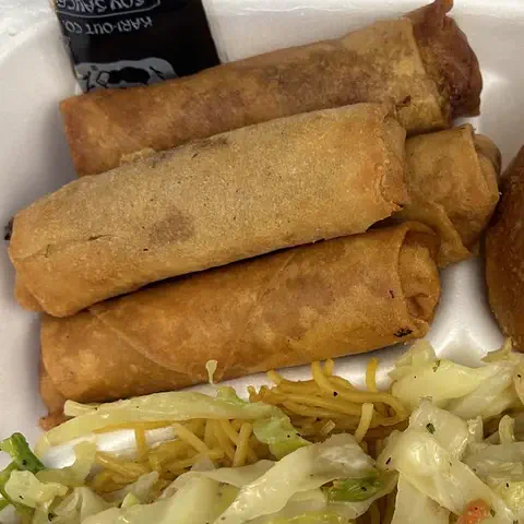 Lumpia and a bread roll from a takeout combo